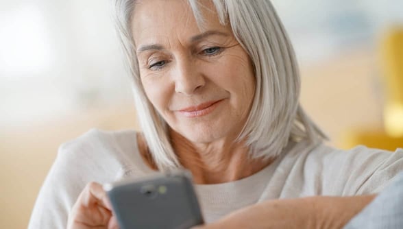 Photo of older woman on smartphone Photo of older woman on smartphone