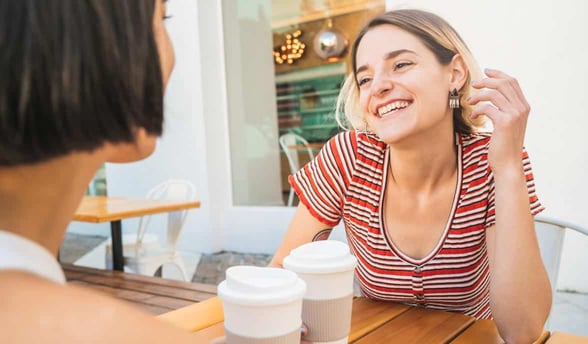 Photo of two women talking