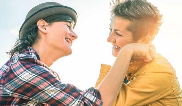 Photo of two women laughing