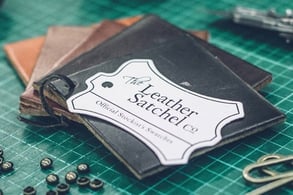 The Leather Satchel co. logo on leather samples The Leather Satchel co. logo on leather samples