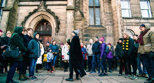 Photo of tour guide leading participants on The Potter Trail