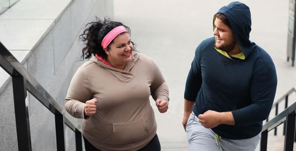 Photo of a couple running together