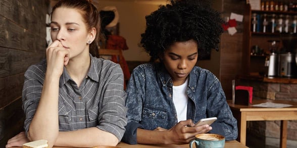 Photo of two women not talking Photo of two women not talking