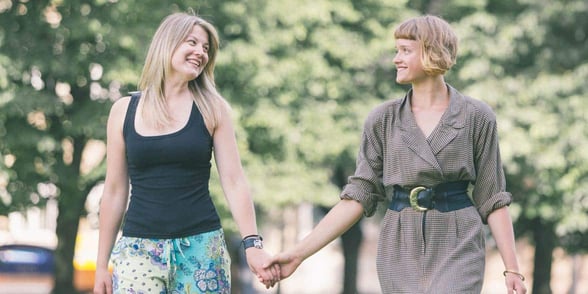 Photo of lesbian couple walking Photo of lesbian couple walking