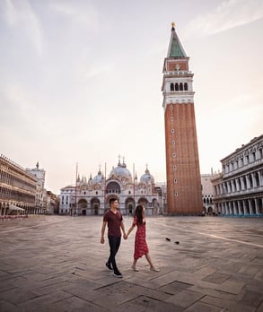 Photo of couple walking through Italian city Photo of couple walking through Italian city