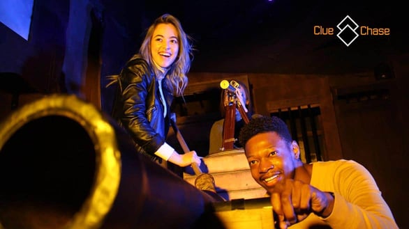 Photo of couples in a Clue Chase escape room