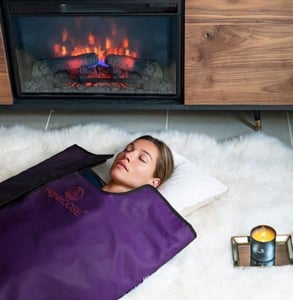 Photo of a woman in a sauna blanket