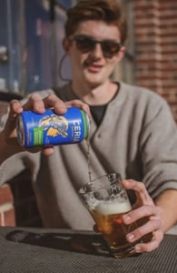 Photo of a guy drinking CERIA beer