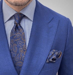 Photo of a blue suit with matching accessories