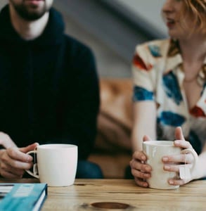 Photo of a couple enjoy coffee at home