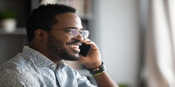 Photo of a man talking on the phone