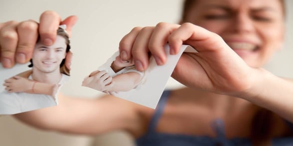 Photo of woman ripping up photo