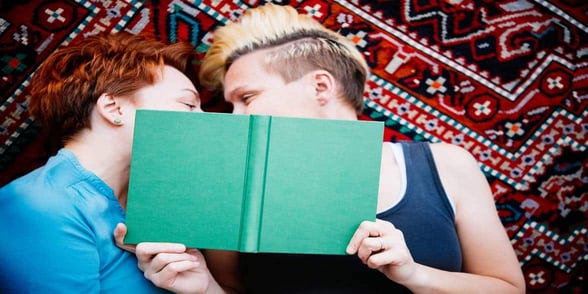 Photo of lesbian couple reading Photo of lesbian couple reading