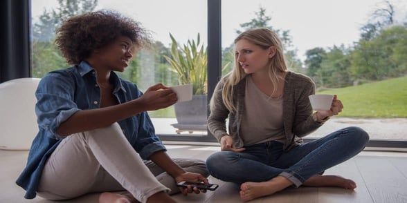Photo of two women talking Photo of two women talking