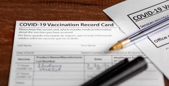 Photo of a COVID vaccination card Photo of a COVID vaccination card