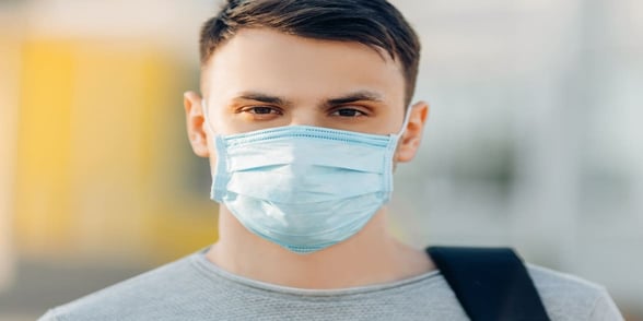 Photo of man wearing mask