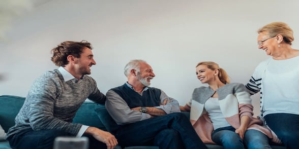 Photo of senior couple with adult children