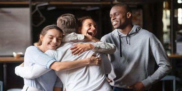 Photo of friends and family hugging Photo of friends and family hugging