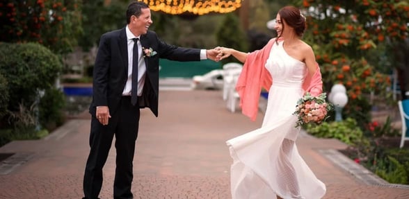 couple holding hands and smiling