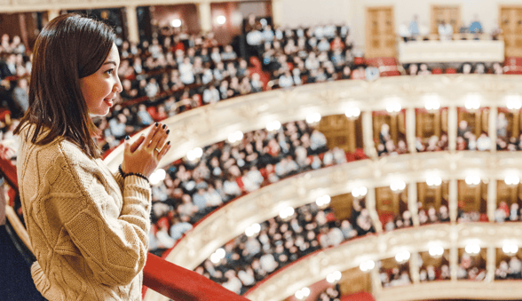 Photo of a woman in balcony seating