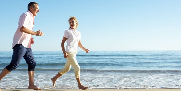 couple running on the beach
