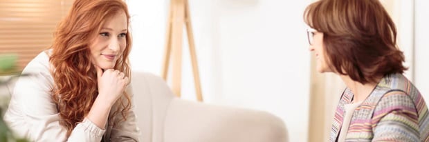 Personal life coach talking to her client during a session