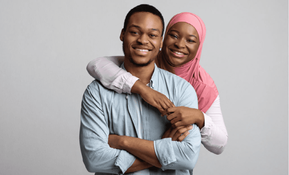 couple smiling and embracing