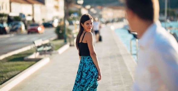 Woman looking behind her Woman looking behind her