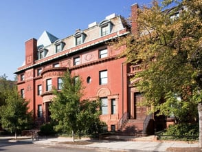 Exterior view of the Phillips Collection, a early-20th century building on a tree-lined street
