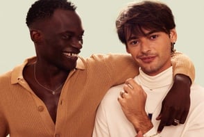 two men with their arms wrapped around each other