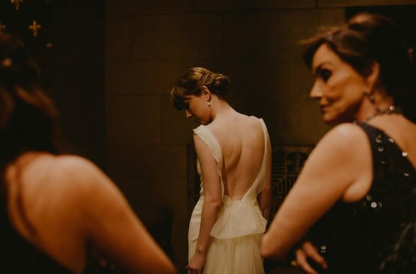 woman standing with her back to the camera