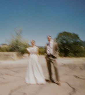 blurry photograph of man and woman standing