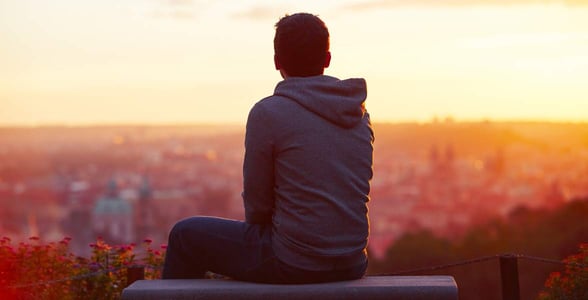 Photo of a man sitting alone