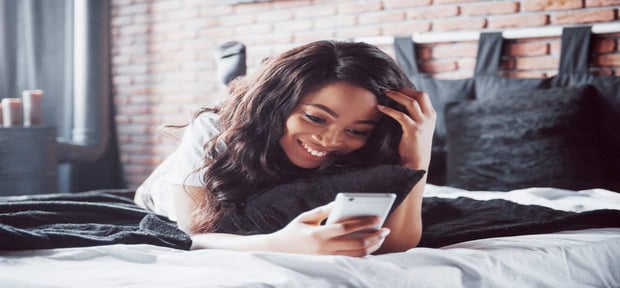 Photo of a woman looking at her phone