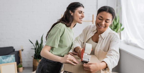 Photo of two women packing