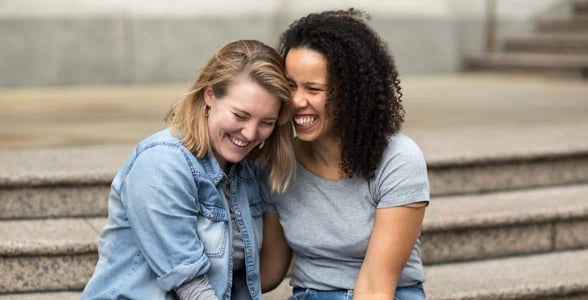 Photo of two women laughing Photo of two women laughing