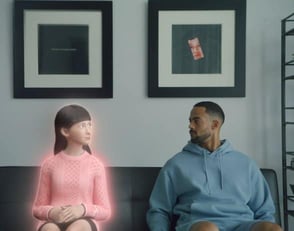 man and AI avatar look at each other