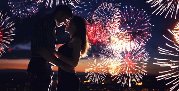 Photo of a couple watching fireworks Photo of a couple watching fireworks