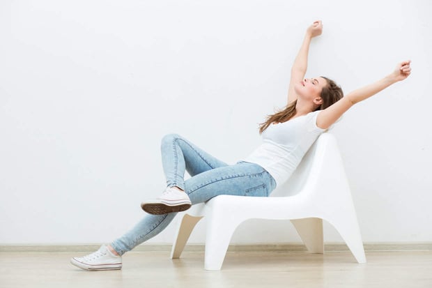 Photo of single woman with arms outstretched