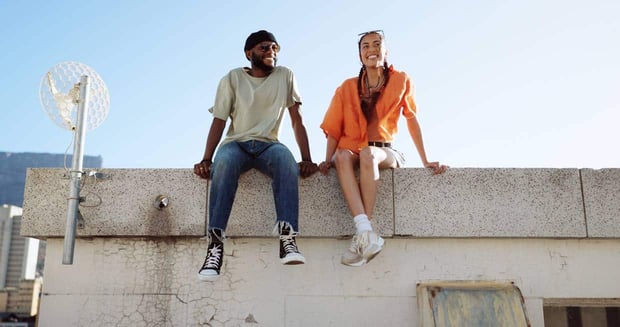 Photo of couple talking on the roof