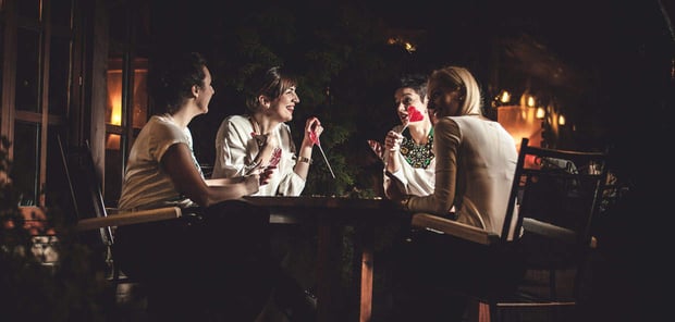 Photo of friends talking at a table