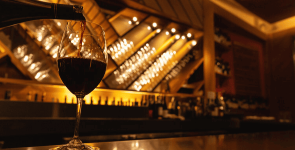 Wine being poured into a glass at Corkbuzz