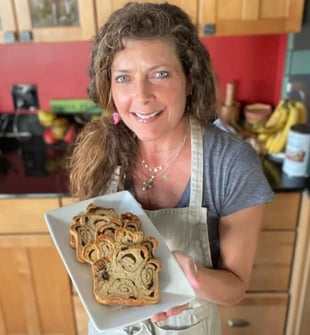 gluten free Jules blog writer holding bread