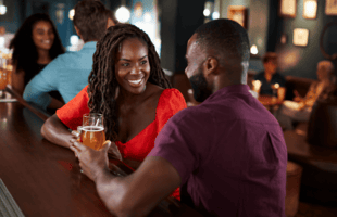 A couple enjoying drinks on a date.