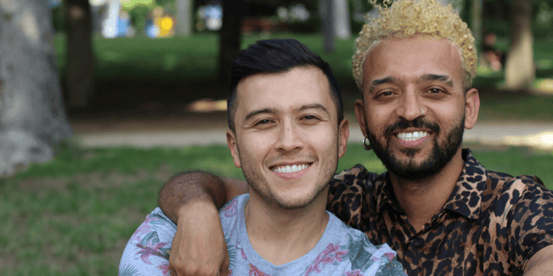 Gay interracial couple smiling