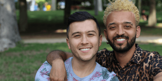 Gay interracial couple smiling Gay interracial couple smiling