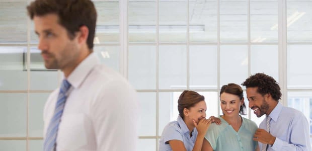 Photo of coworkers gossiping