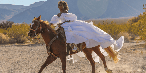 Bride at Sandy Valley Ranch riding a horse