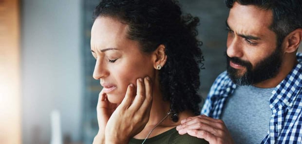 Photo of a man comforting a woman