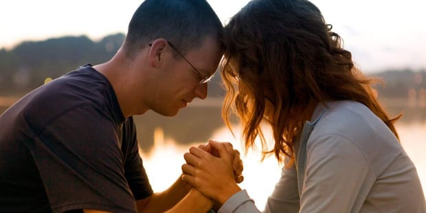 Photo of a couple praying Photo of a couple praying